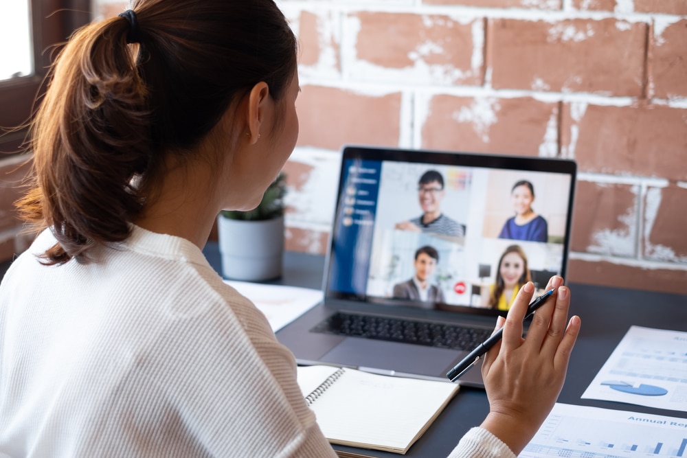 Female virtual legal assistant attending an online meeting with a client via video call.