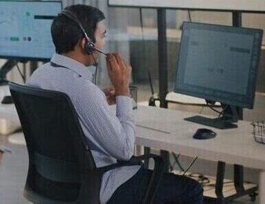 Focused Filipino virtual legal assistant providing professional client support in a busy remote work environment.