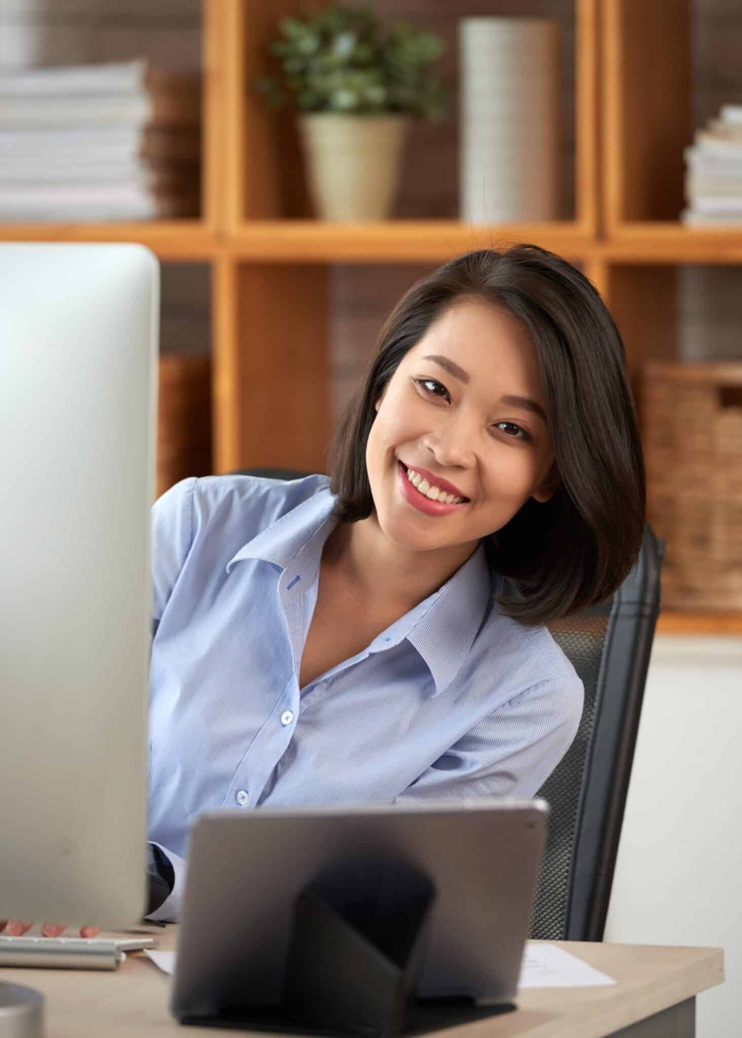 clinic staff efficiently reviewing patient charts on laptop